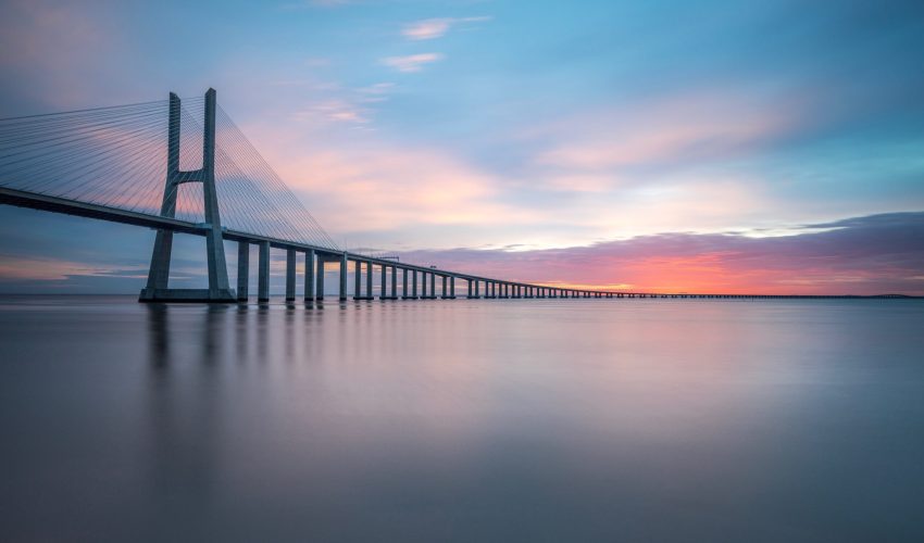 vasco-da-gama-bridge-tagus-river-against-sky-sunset